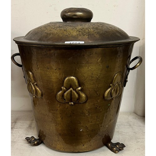 1064 - An Indian brass spittoon, with elephant ring handles, 35 cm high, and a coal bucket (2)