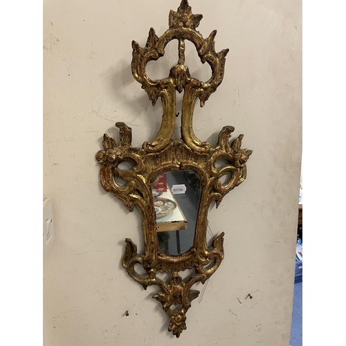 1478 - A carved gilt wood wall mirror, 70 x 33 cm