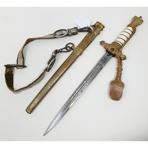 600 - A German World War II dagger, with a scabbard and hanger, 42 cm