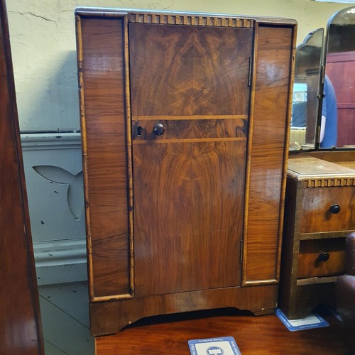 861 - An Art Deco miniature suite of bedroom furniture, comprising two wardrobes, a dressing table, a simi... 