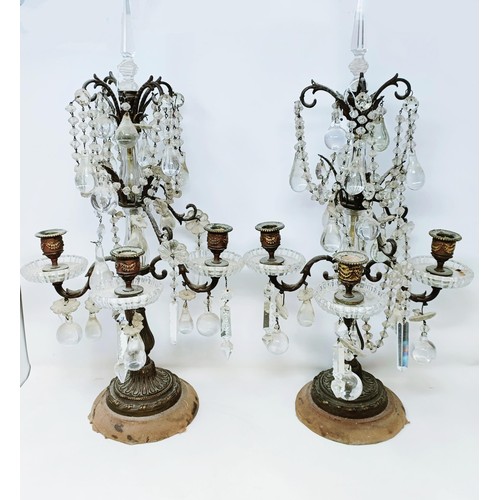 1030 - A pair of glass and metal three light candelabra, some loss, 60 cm high and another similar pair, 33... 