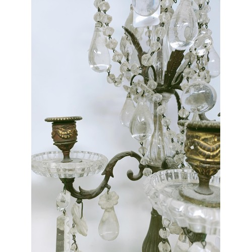 1030 - A pair of glass and metal three light candelabra, some loss, 60 cm high and another similar pair, 33... 