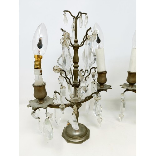 1030 - A pair of glass and metal three light candelabra, some loss, 60 cm high and another similar pair, 33... 