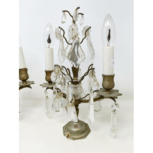 1030 - A pair of glass and metal three light candelabra, some loss, 60 cm high and another similar pair, 33... 