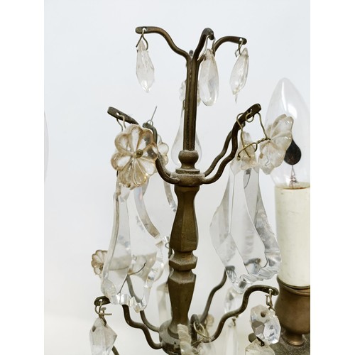 1030 - A pair of glass and metal three light candelabra, some loss, 60 cm high and another similar pair, 33... 