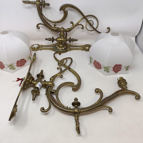 1096 - A pair of Art Nouveau style wall lights, with glass shades, 40 cm wide