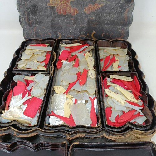 796 - A large collection of mother of pearl and bone gaming counters in a laquered box, two other boxes (3... 