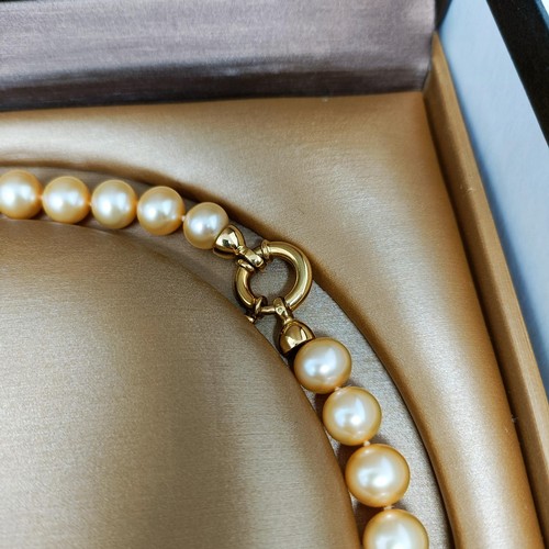 219 - A Mikoya pearl necklace, with an 18ct gold clasp, and matching earrings, in a presentation box