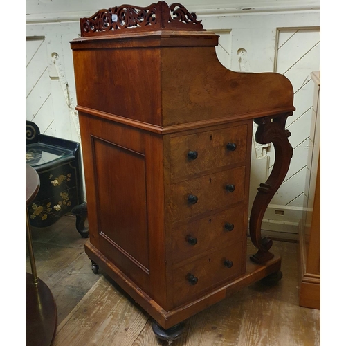 862 - A 19th century piano top walnut Davenport, the interior fitted with various compartments and inset a... 