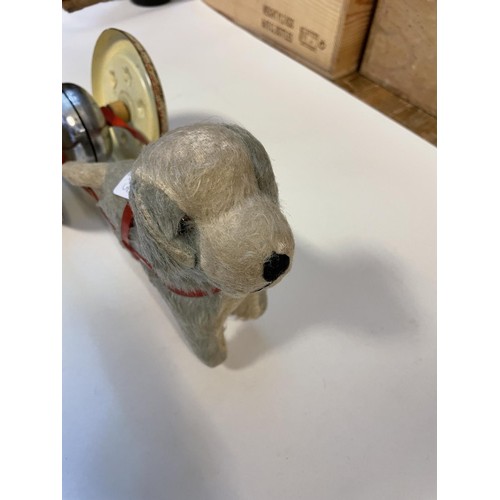 728 - A vintage push along tinplate pony, two push along dogs, a tinplate police car, and a cart (5)