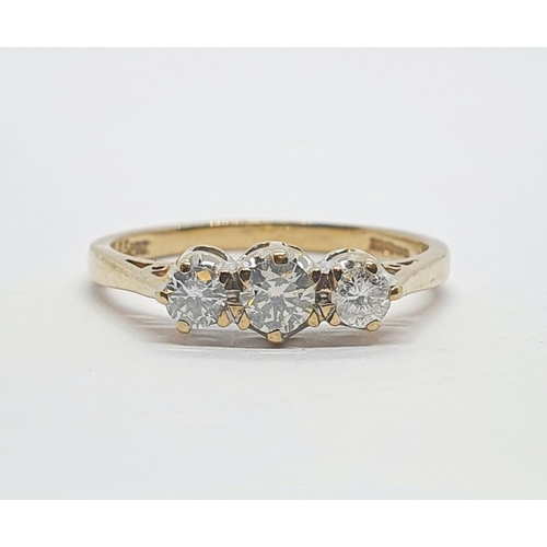 164 - A 9ct gold and three stone diamond ring, ring size L