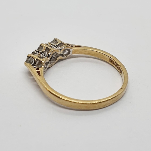 164 - A 9ct gold and three stone diamond ring, ring size L