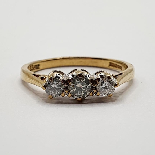 164 - A 9ct gold and three stone diamond ring, ring size L