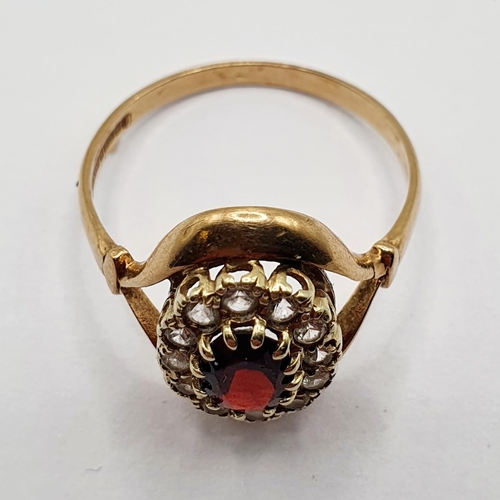 29 - A 9ct gold and garnet set cluster ring, ring size T 1/2...