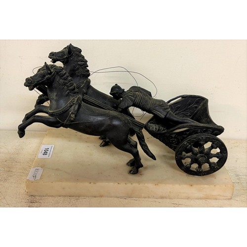 638 - A bronze Roman style chariot group, on a white marble base, 21 cm high