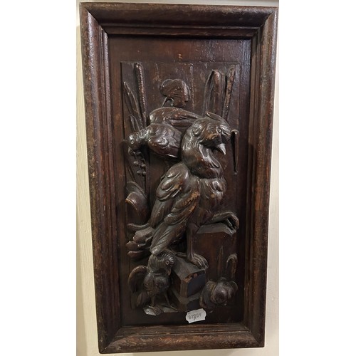 799 - A pair of carved oak panels, decorated game, 48 x 25 cm