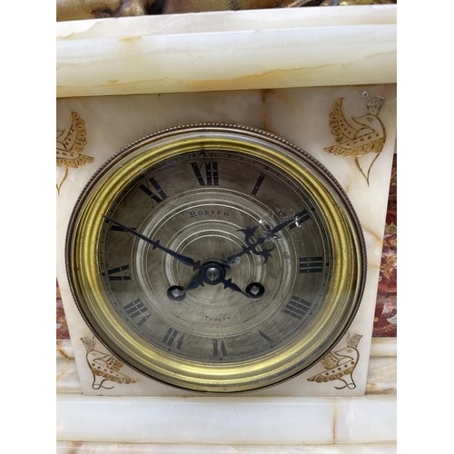 708 - An early 20th century Egyptian revival style mantel clock, the 13 cm diameter silvered dial with Rom... 