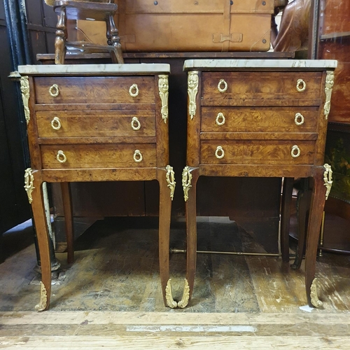 880 - A pair of French inlaid walnut bedside chests, having a marble top above three drawers, on cabriole ... 