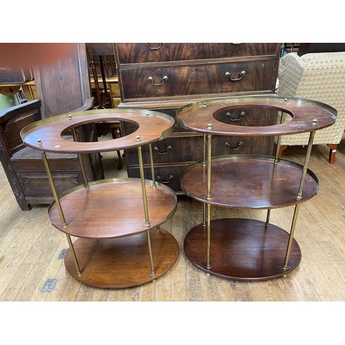 886 - An unusual pair of mahogany and brass campaign oval washstands, having three tiers, 85 cm high x 70 ... 