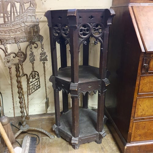 881 - An oak Gothic Revival two tier stand, 100 cm high