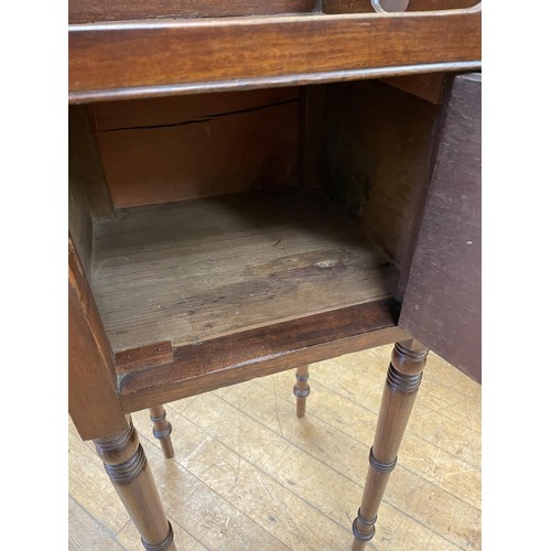 991 - A 19th century mahogany tray top stand, with a single cupboard door, 30 cm wide