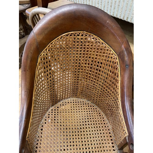 992 - An early 19th century mahogany childs bergere high chair, on a stand