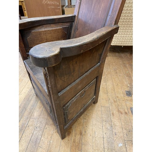 996 - An oak lambing chair, with carved decoration