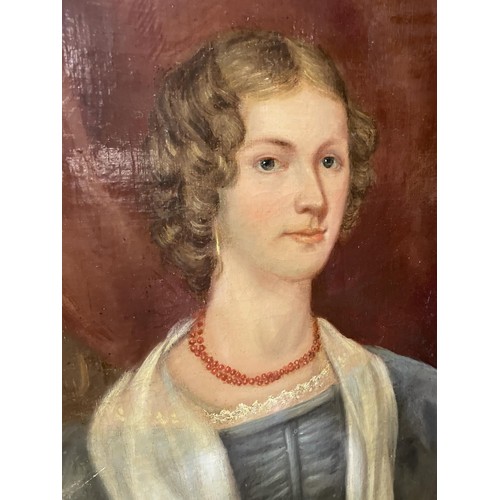 302 - English school, 19th century, a bust portrait of a lady, oil on canvas, 72 x 58 cm