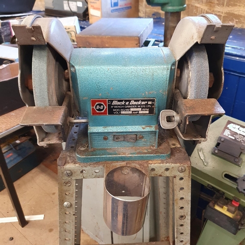 545 - A Warco 4 1/2 inch metal cutting band saw, and a Black & Decker bench grinder, on an associated stan... 