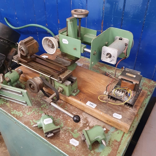 546 - A green painted grinding set-up, with various parts, and a workshop stand