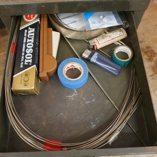 548 - Assorted tools and other items, in a painted metal filing cabinet, 29 cm wide