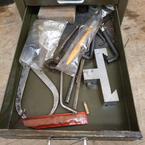 548 - Assorted tools and other items, in a painted metal filing cabinet, 29 cm wide