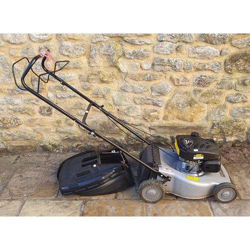 552 - A Mountfield petrol lawn mower and a three piece conservatory suite (4)