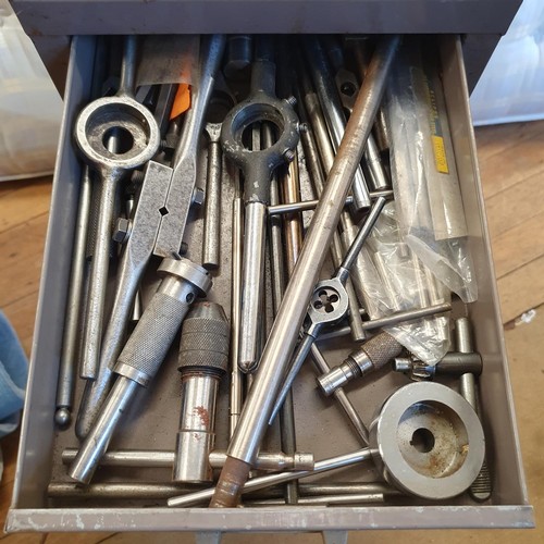 544 - Assorted tools and other items, in a painted metal filing cabinet, 29 cm wide