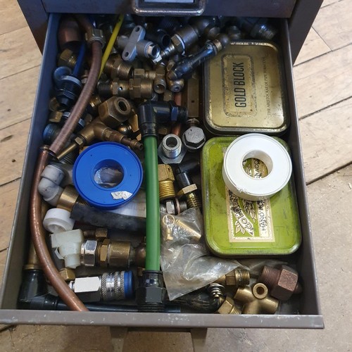 544 - Assorted tools and other items, in a painted metal filing cabinet, 29 cm wide