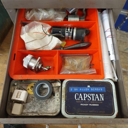 547 - Assorted tools and other items, in a painted metal filing cabinet, 29 cm wide