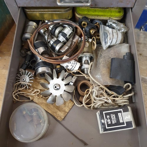 547 - Assorted tools and other items, in a painted metal filing cabinet, 29 cm wide