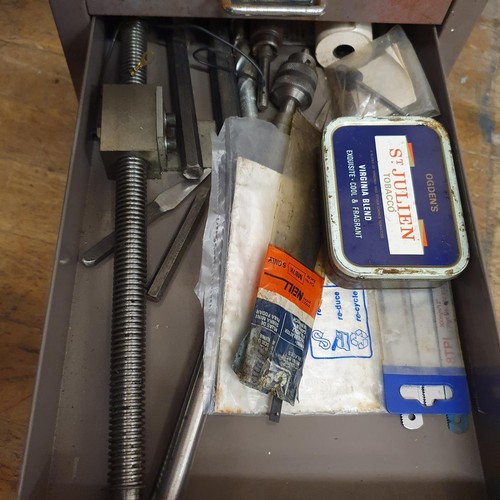 547 - Assorted tools and other items, in a painted metal filing cabinet, 29 cm wide