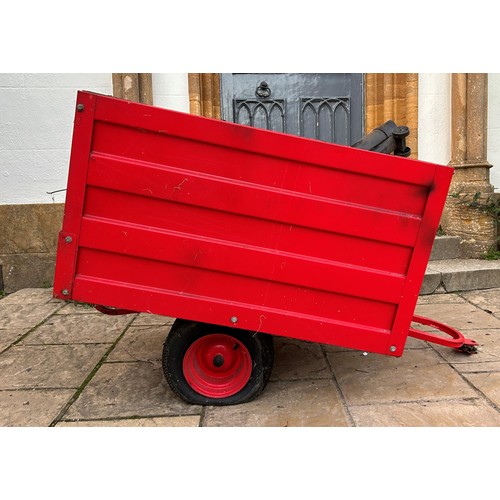 528 - A universal red painted garden tractor trailer  
Note: From a deceased estate, being sold without re... 