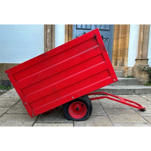 528 - A universal red painted garden tractor trailer  
Note: From a deceased estate, being sold without re... 