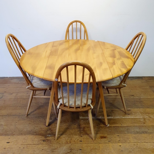 10 - An Ercol light elm drop leaf dining table, 156 cm wide, and a set of four hoop back dining chairs (5... 