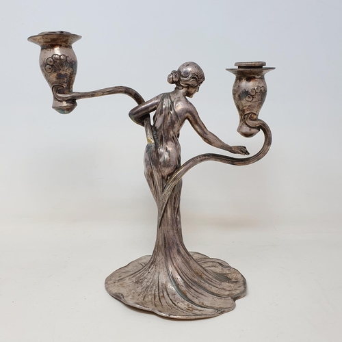 108 - A WMF silver plated figural two branch candelabrum, 21 cm wide