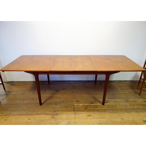 15 - A Mackintosh extending dining table, 160 cm wide, and six matching chairs (7)