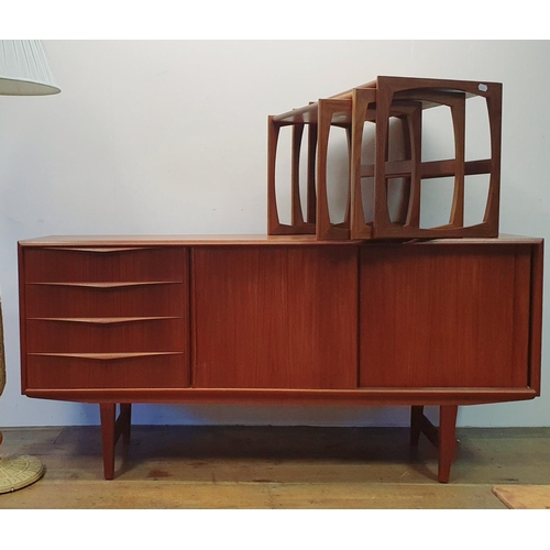 17 - A teak sideboard and a nest of tables (2)