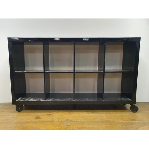 20 - A black lacquered vinyl stand, 165 cm wide