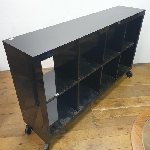 20 - A black lacquered vinyl stand, 165 cm wide