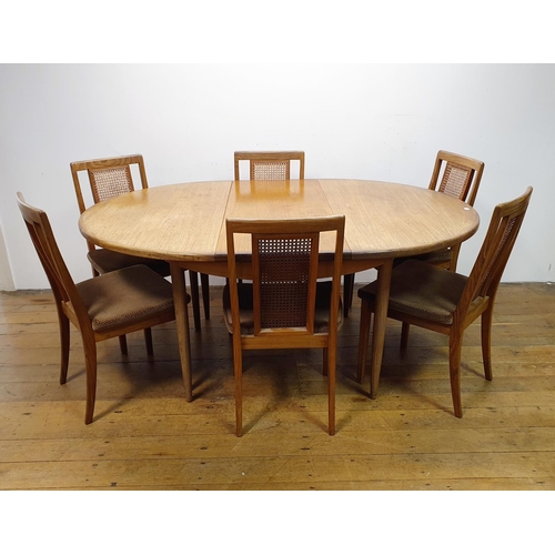 28 - A G-Plan extending dining table, 124 cm diameter and six matching chairs (7)