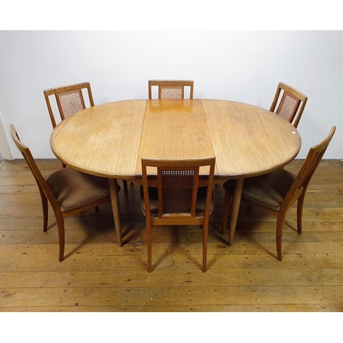 28 - A G-Plan extending dining table, 124 cm diameter and six matching chairs (7)