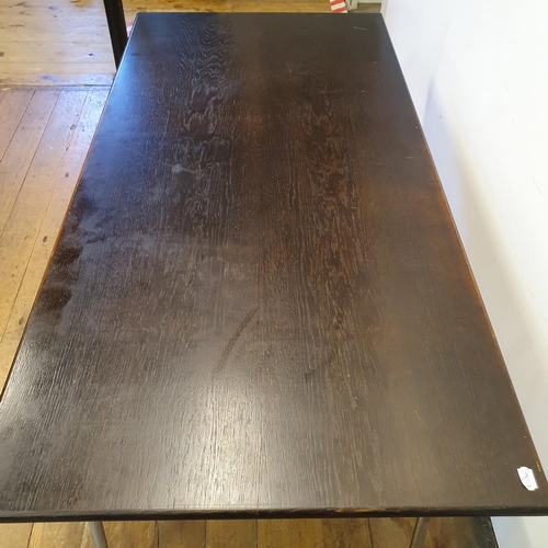 32 - A 1970s chrome and stainwood table, 154 cm wide