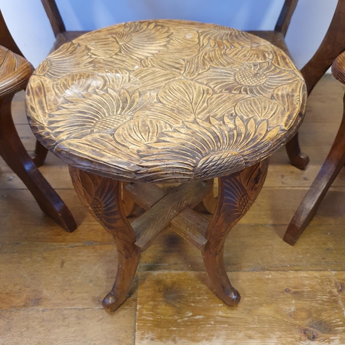 36 - A pair of Japanese carved wood high back chairs, a similar two tier table, 88 cm wide, a round table... 